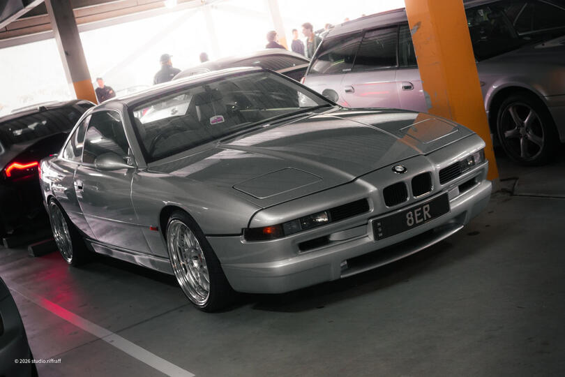Untitled A silver BMW 840Ci in a parking garage, lit by the morning light