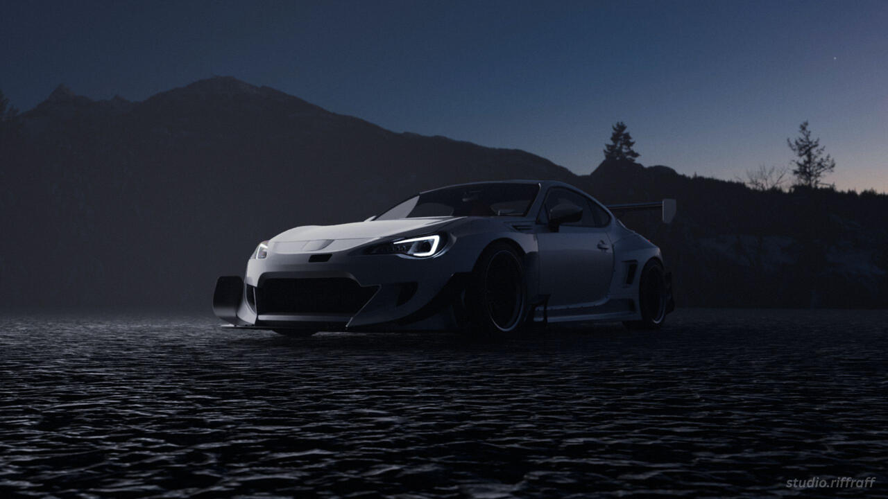 A pandem subaru brz in the snowy mountains at night