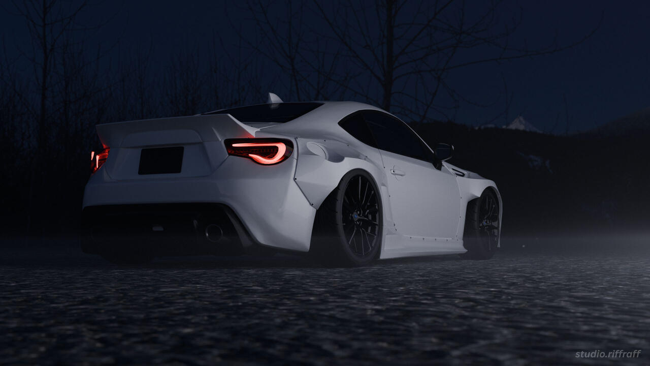 A pandem subaru brz in the snowy mountains at night