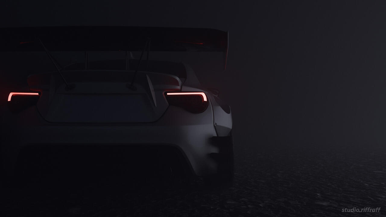 A pandem subaru brz in the snowy mountains at night