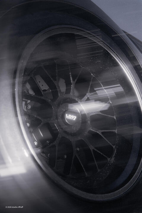 The wheel of a pandem subaru brz in the snowy mountains at night